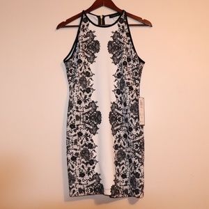 White with black detail bodycon dress.